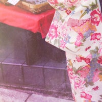 a woman wearing a floral kimono
